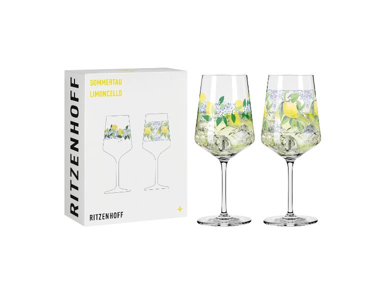 Zwei Limoncello-Gläser mit Zitronen- und Blumenmuster, daneben eine weiße Box.