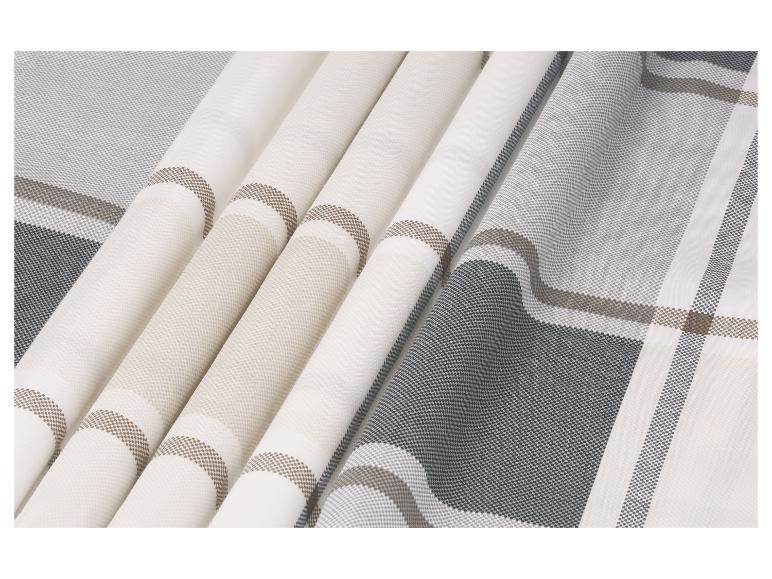 Stoff mit Karomuster in Grau-, Braun- und Weißtönen, gefaltet
