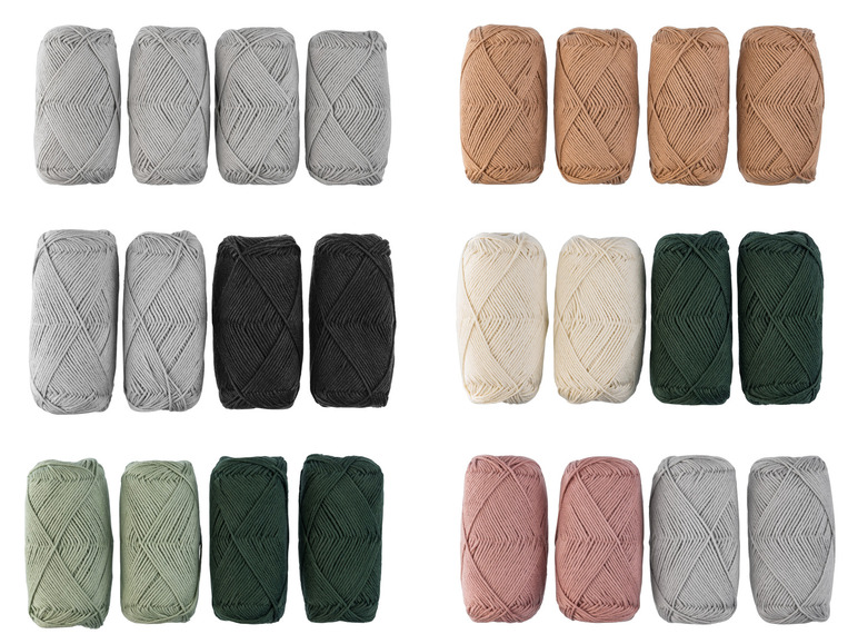 Garnrollen in verschiedenen Farben, darunter Grau, Beige, Schwarz, Weiß und Grün.