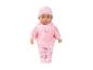 Babypuppe im rosa Schlafanzug mit Herzen und Rosen.