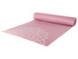 Eine rosa Yogamatte mit einem weißen Mandala-Muster.