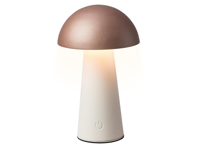 Pilzförmige Tischlampe mit roségoldener Oberseite und weißem Sockel, die warmes Licht abgibt.