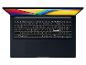 Ein offenes Laptop mit einem Bildschirm, der lebendige Farben zeigt, und einer beleuchteten Tastatur.