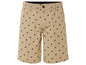 Beige Shorts mit einem Muster aus schwarzen Reitern