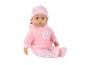 Babypuppe in einem rosa Outfit mit Herz- und Rosenmustern