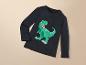 Ein dunkelblaues Langarmshirt mit einem grünen Dinosaurier