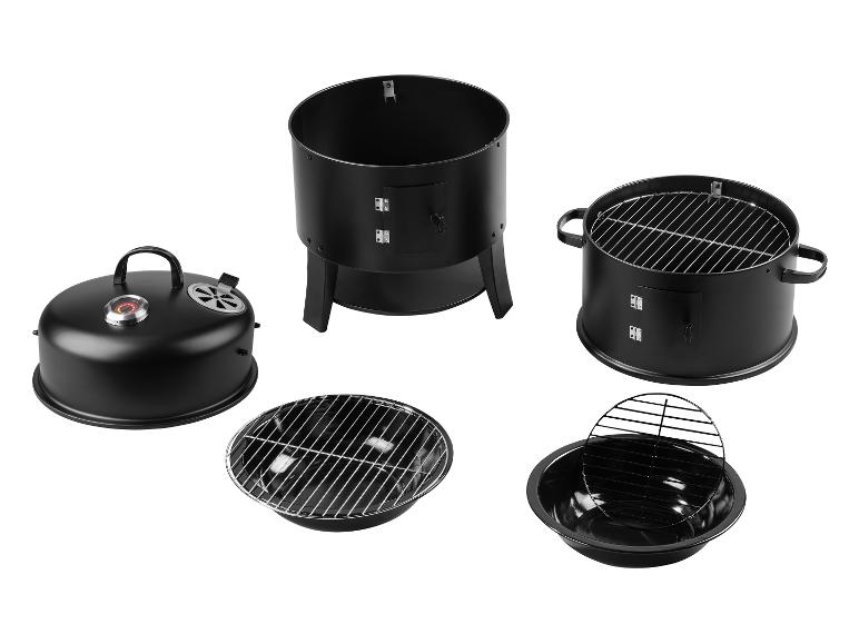Schwarzes Grill- und Räucherset, in Einzelteile zerlegt.