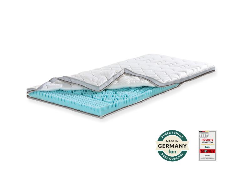 Matratze mit blauer Oberschicht, mit Qualitäts- und Kompetenzzertifikaten.