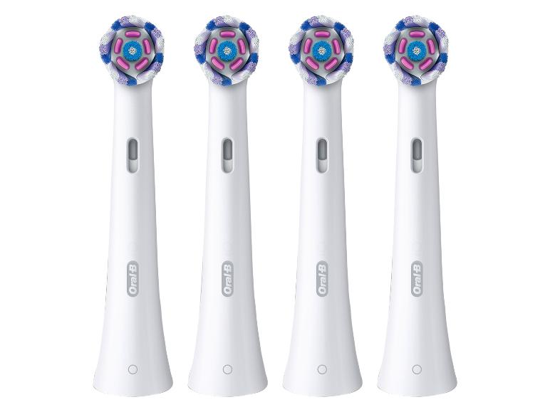 Vier Oral-B elektrische Zahnbürstenköpfe.