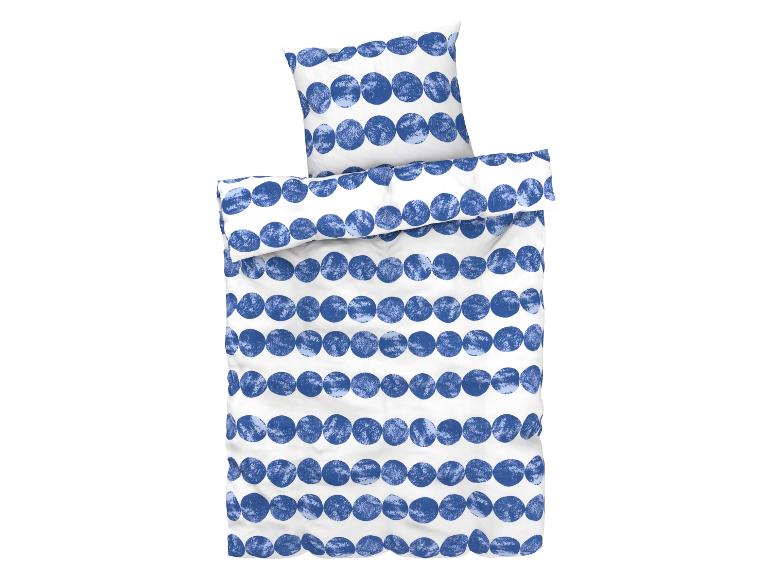 Ein Bettbezug und ein Kissenbezug mit einem blauen Punkte-Muster.