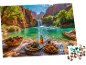 Ein Puzzle, das ein idyllisches Picknick an einem türkisfarbenen See mit Wasserfall zeigt.