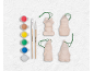 Malset für Weihnachtsschmuck mit Farben, Pinseln und vier Keramikfiguren.