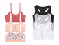 Zwei Sport-BHs mit Blumenmuster und drei einfarbige Sport-BHs.