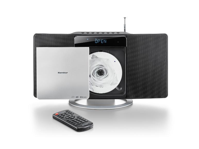 Silberne Mikro-Stereoanlage mit CD-Player und Fernbedienung auf weißem Hintergrund.