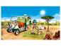 Playmobil Tierarztfahrzeug mit Figur, Hund und Affe in einer Safari-Umgebung.