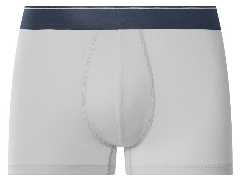 Weiße Herren-Boxershorts mit dunkelblauem Bund und hellen Streifen.