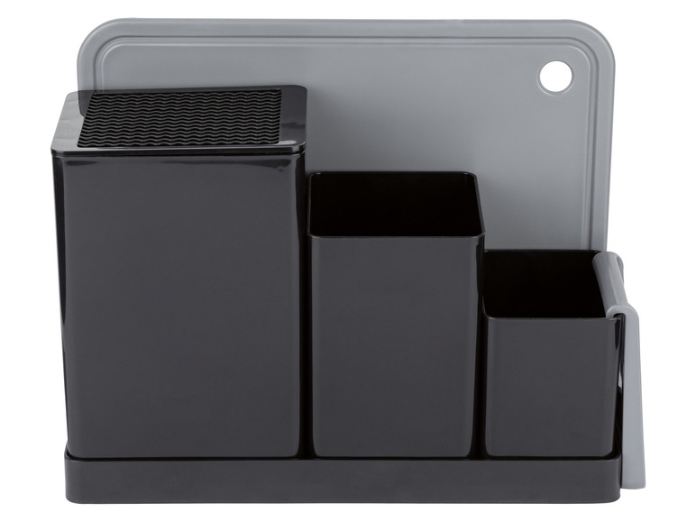 Ein schwarzer Messerblock mit drei Fächern und einem grauen Schneidebrett.