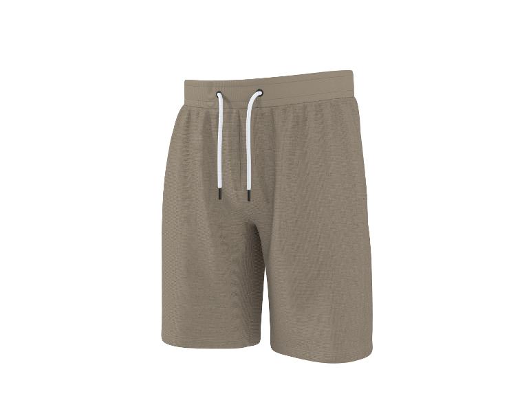 Khakifarbene Sweatshorts mit weißem Kordelzug.