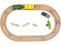 Holzeisenbahn-Set mit grünem und gelbem Zug, Bauklötzen und einem Baum.