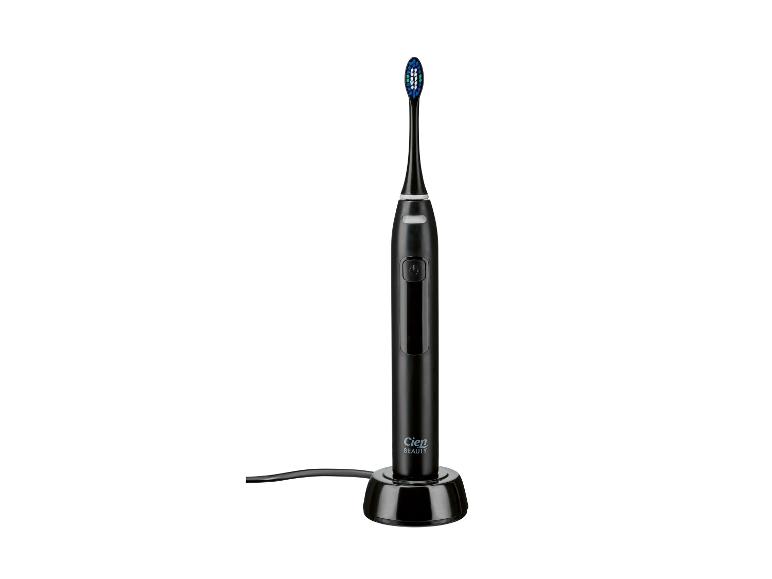 Schwarze Cien Beauty elektrische Zahnbürste auf einer Ladestation.
