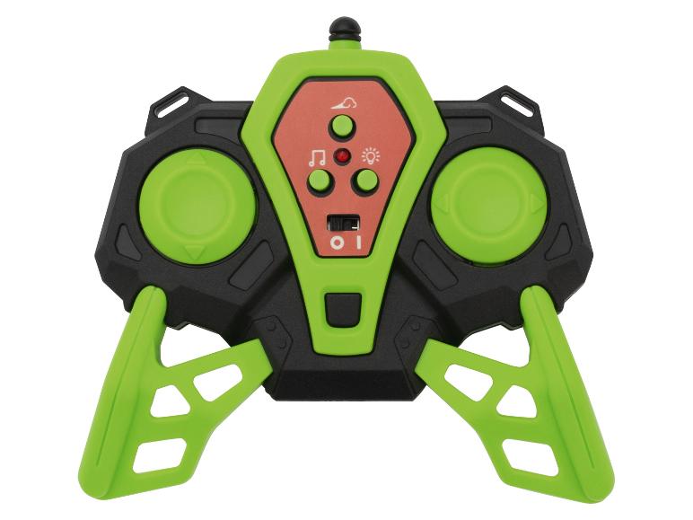 Grüne und schwarze Spielzeugfernbedienung mit Tasten und Joysticks.