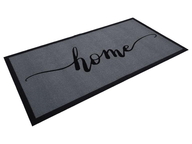 Graue Fußmatte mit schwarzem Rand und dem Wort „home“ in schwarzer Schrift