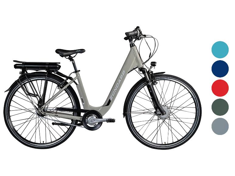 Graues Zündapp E-Bike mit Akku am Gepäckträger und Farbmustern.