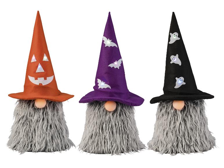 Drei Halloween-Zwerge mit orangefarbenen, lila und schwarzen Hüten mit leuchtenden Verzierungen.