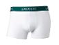 Weiße Lacoste Boxershorts mit grünem Bund.