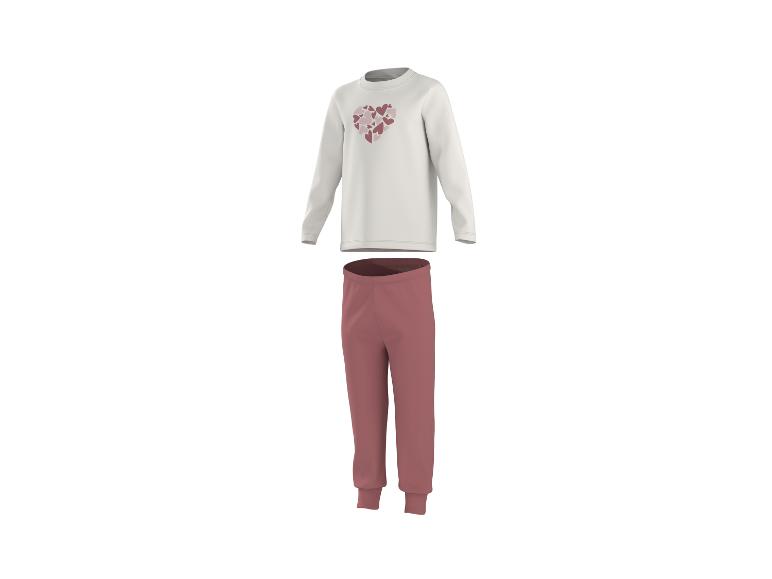 Weißes Langarm-Pyjamaoberteil mit Herzen und dunkelrosa lange Pyjamahose.