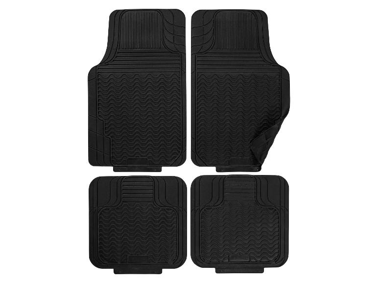 Set aus vier schwarzen Autofußmatten mit Wellen- und Rippenstrukturen.