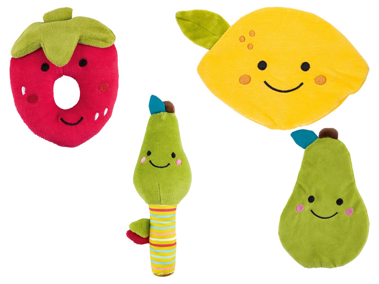 Ein Set aus vier weichen Spielzeugfrüchten: einer Erdbeere, einer Zitrone, einer Birne und einer Birne mit Rassel.