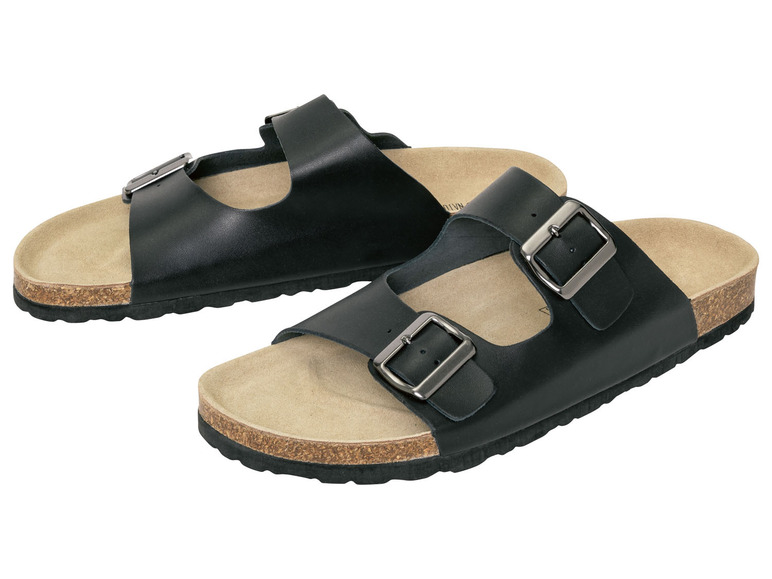 Zwei Paar schwarze Ledersandalen mit Schnallen.