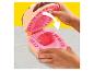 Play-Doh Spielset mit einem Figurenkopf, der die geformte Zunge zeigt.