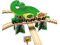 Holzeisenbahn-Set im Dinosaurier-Design mit grünem LKW, Güterwagen und großer Dinosaurierfigur.