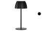 Schwarze Tischlampe mit plissiertem Schirm und rundem Fuß, mit weißen und schwarzen Farboptionen.
