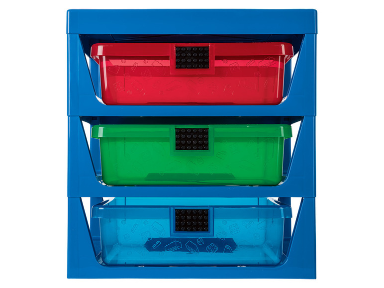 Eine stapelbare Aufbewahrungsbox mit drei Schubladen für LEGO-Steine in rot, grün und blau.