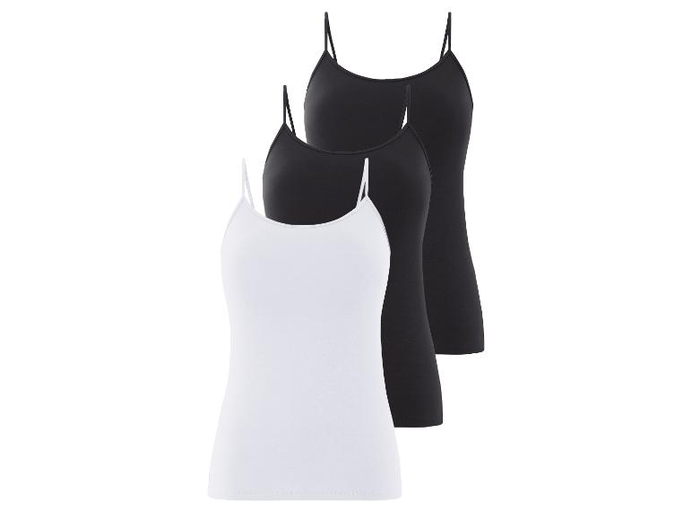 Drei einfache Tanktops, zwei schwarz und eins weiß.
