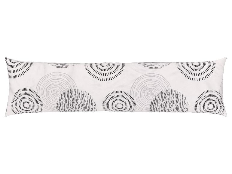 Ein weißer Kissenbezug mit schwarzen Kreisdesigns.