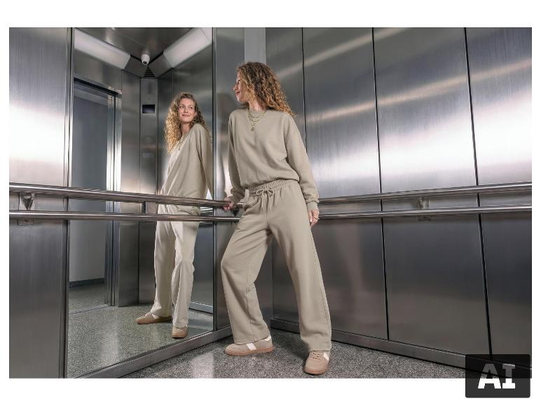 Frau im Aufzug in ESMARA® Damen-Sweatshirt und passender Hose. [KI-generiertes Bild]