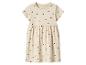 Beiges Kinderkleid mit kurzen Ärmeln und schwarzen Herzen.