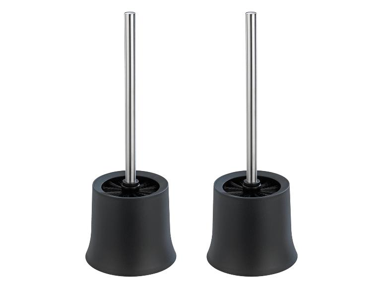 Zwei schwarze Toilettenbürsten mit Metallgriff.