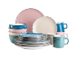 Bunte Teller, Schalen und Tassen in Rosa, Blau, Beige und Türkis mit dunklem Rand.