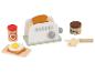 Holztoaster mit Toast, Eiern, Erdbeermarmelade und Haselnussaufstrich.