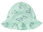 Ein mintgrüner Babyhut mit Delfin-Muster.