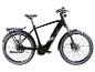 Schwarzes E-Bike mit Gepäckträger und Schutzblechen, akzentuiert mit gelben und grauen Streifen.