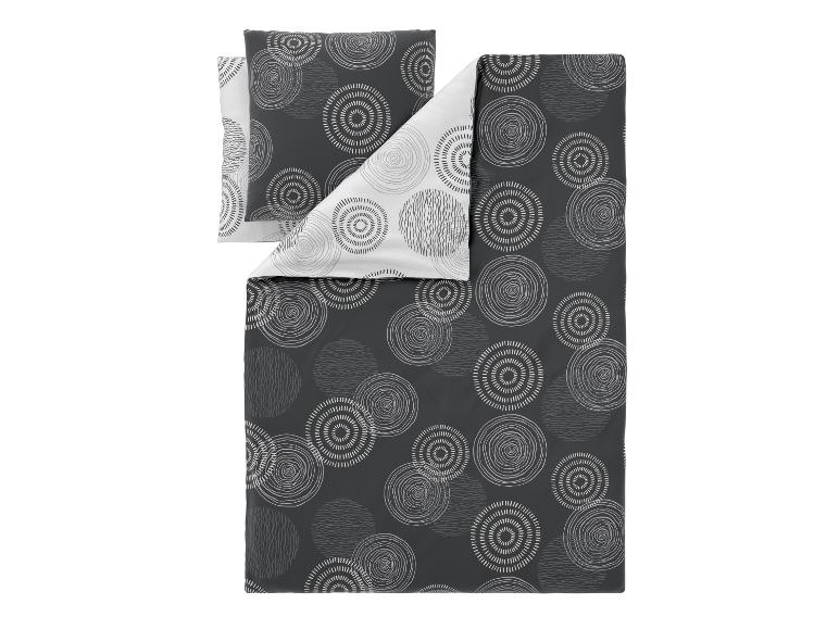 Bettwäsche-Set mit Kissenbezug und Deckenbezug in Grau und Weiß mit Kreismuster.