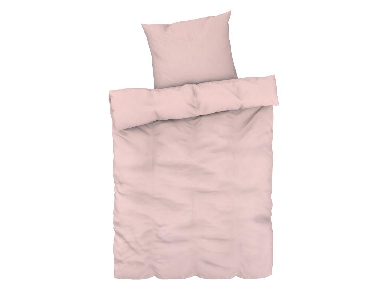 Ein rosa Bettbezug mit Kissenbezügen.