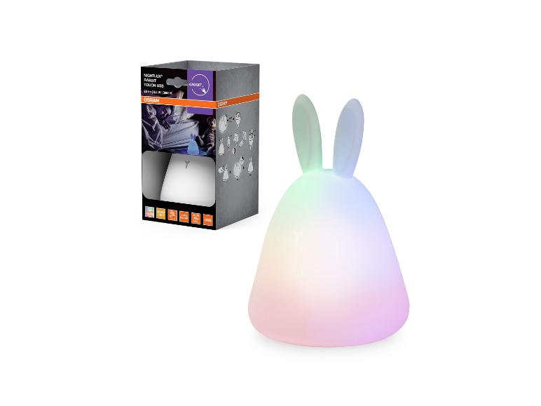 Hasenförmiges Nachtlicht mit USB und farbwechselnden LEDs, neben der Verpackung.