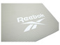 Eine beige Reebok Yogamatte mit geriffelter Textur.